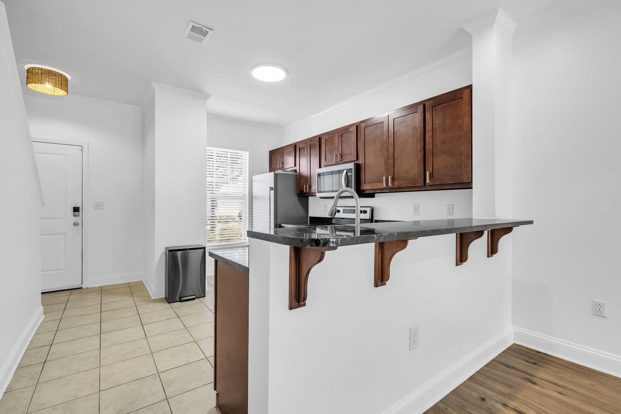 29 North Sand Palm Road Freeport, FL 32439 - Photo 34 of 40 a kitchen with stainless steel appliances granite countertop a refrigerator a stove a sink and dishwasher