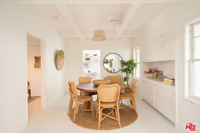 a view of a dining room and a window