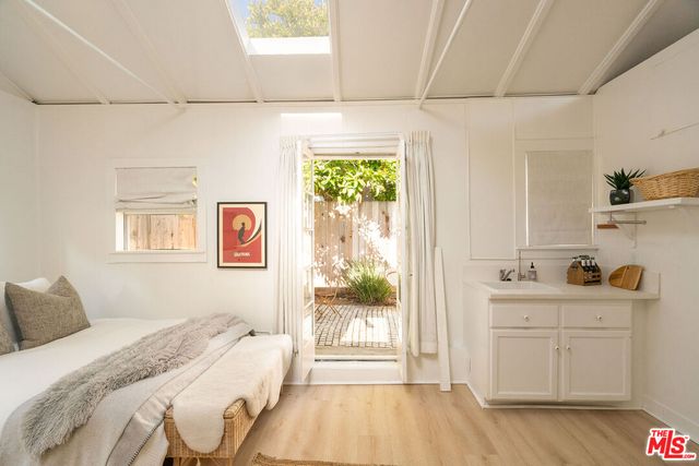 a bathroom with a sink and a window