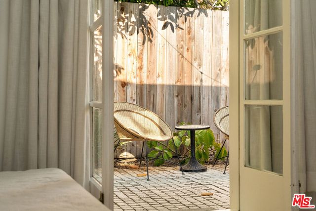 a view of a backyard with a table and chair