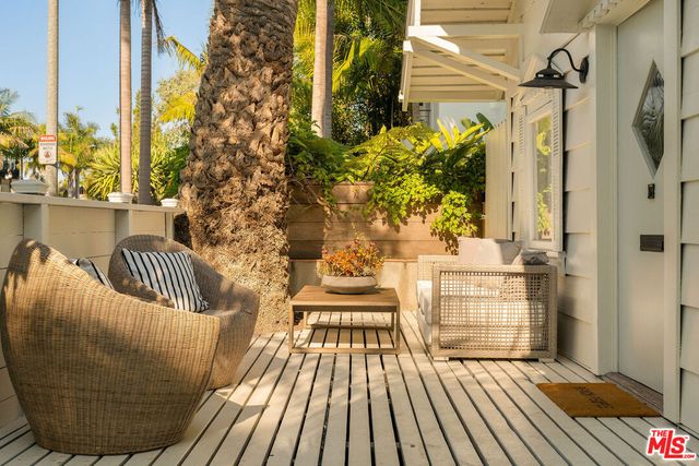 a view of balcony with wooden floor