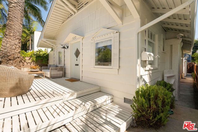 a balcony view with a potted plant