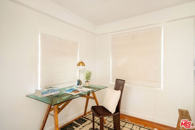 a living room with a table and chairs