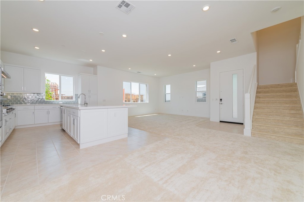 414 Treble Irvine, CA 92618 - Photo 14 of 34 a view of a kitchen with a sink and cabinets