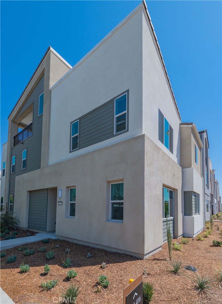 414 Treble Irvine, CA 92618 - Photo 2 of 34 a view of a house with a yard