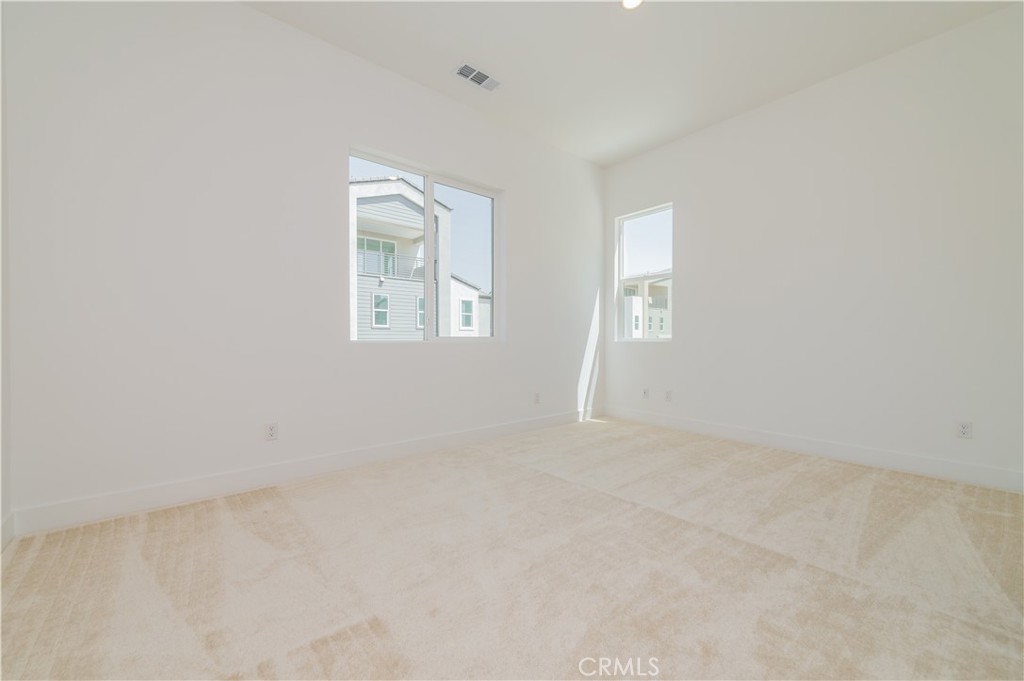 414 Treble Irvine, CA 92618 - Photo 23 of 34 an empty room with windows and closet