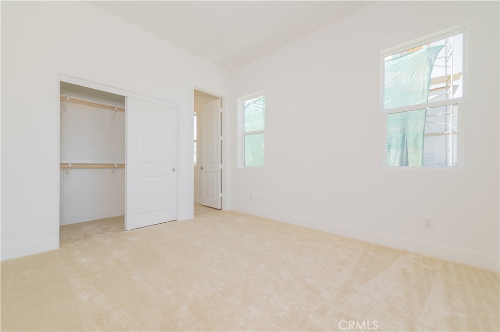 414 Treble Irvine, CA 92618 - Photo 24 of 34 an empty room with windows and closet