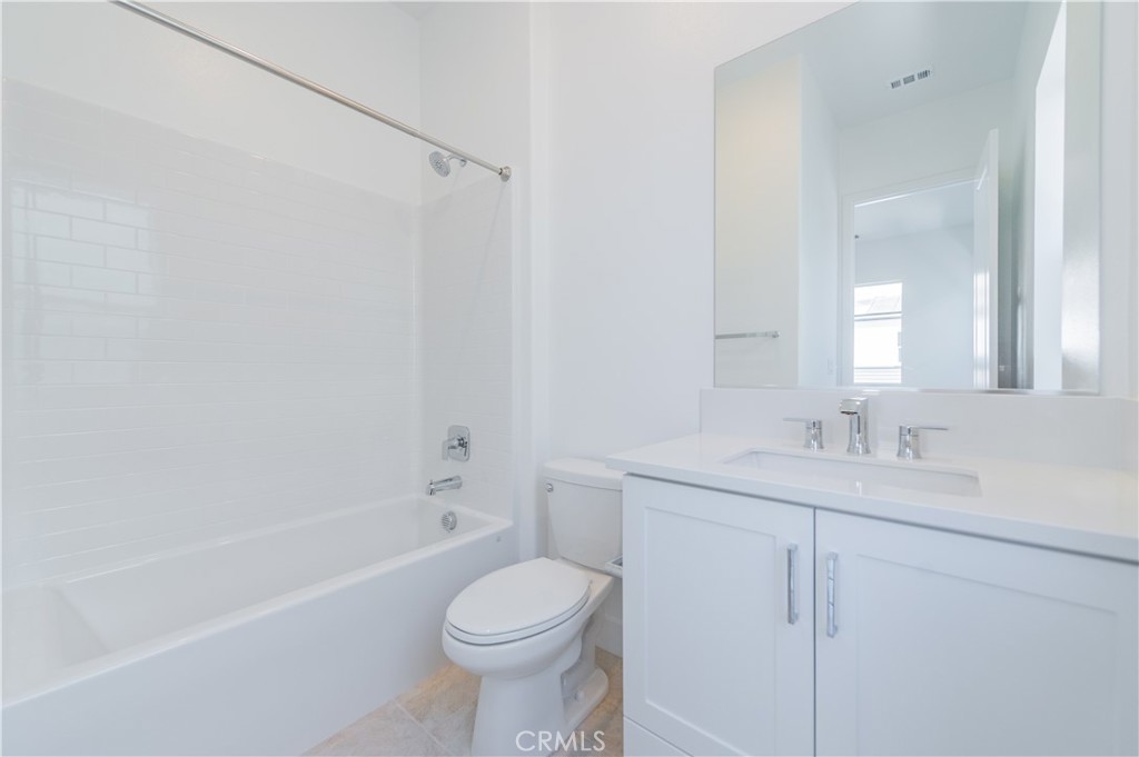414 Treble Irvine, CA 92618 - Photo 25 of 34 a bathroom with a sink a toilet and shower