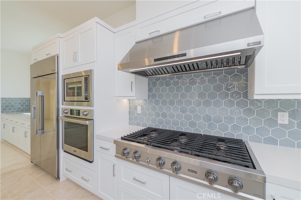 414 Treble Irvine, CA 92618 - Photo 9 of 34 a stove top oven sitting inside of a kitchen
