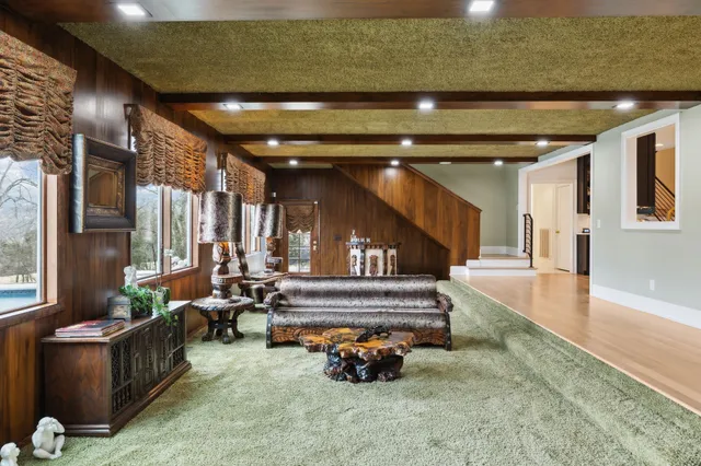 a lobby with furniture and floor to ceiling window