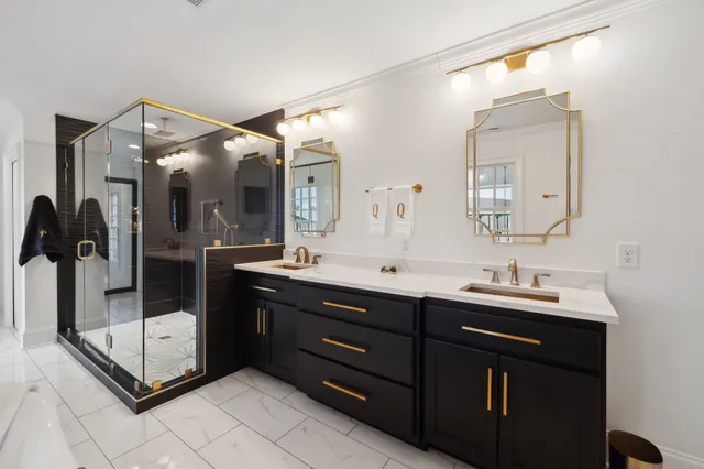 a spacious bathroom with a sink double vanity and a mirror