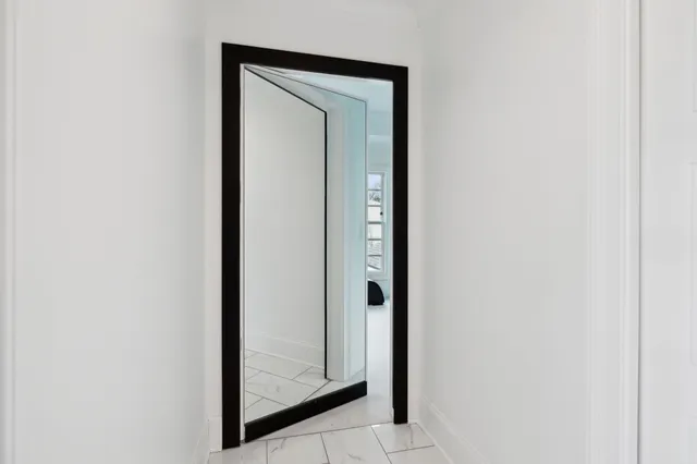 a living room with furniture and pool view