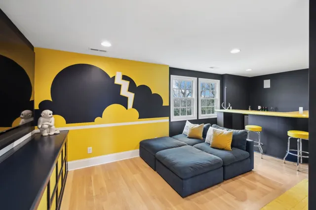 a bathroom with a sink mirror and toilet