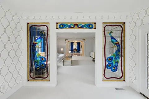 a view of hall way with furniture