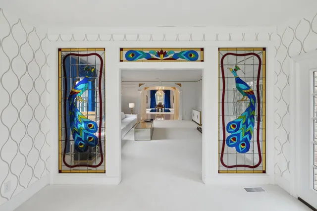 a view of hall way with furniture