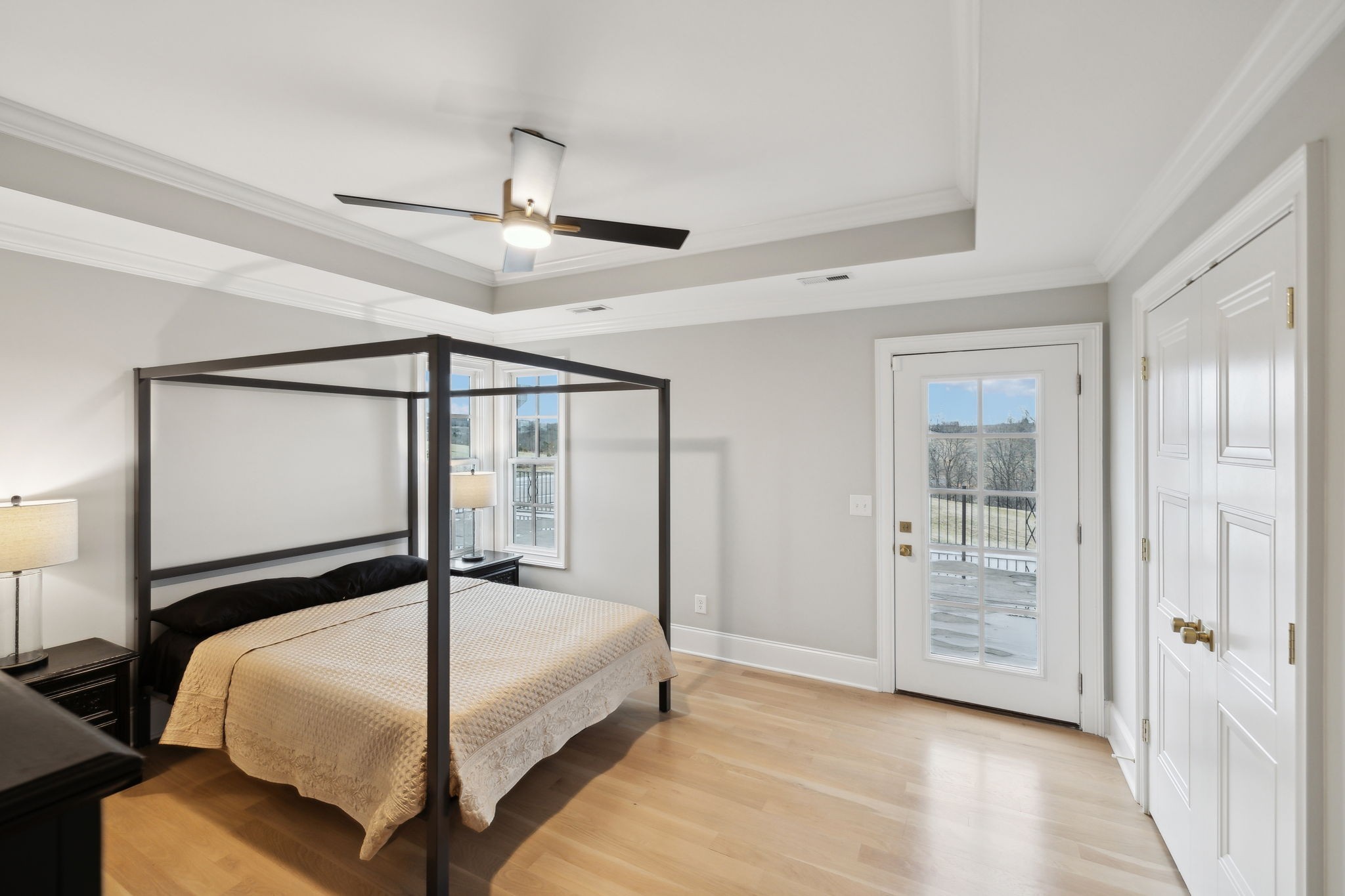 750 Walker Road Beechgrove, TN 37018 - Photo 32 of 54 a bedroom with a large bed and a chandelier