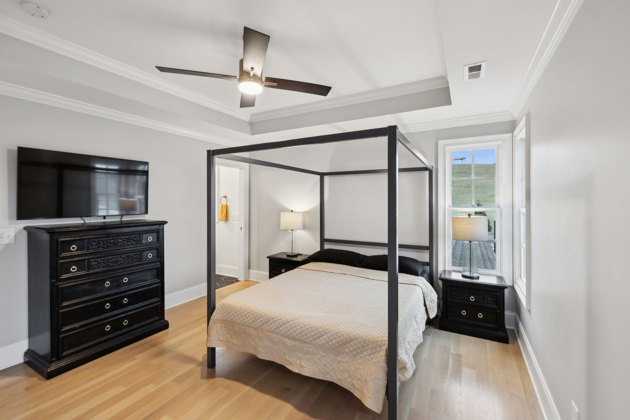 750 Walker Road Beechgrove, TN 37018 - Photo 33 of 54 a bedroom with a bed and a flat tv screen on dresser
