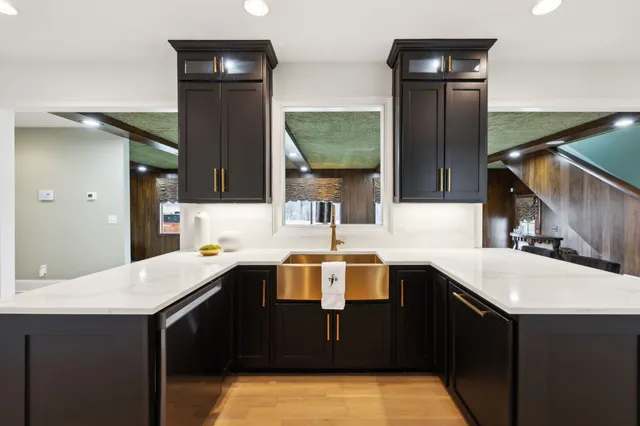 a kitchen with a sink and a refrigerator