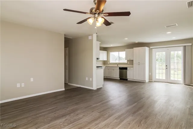 a view of a kitchen with a stove cabinets and wooden floor
