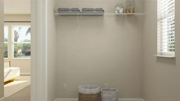 a bathroom with a toilet and a window