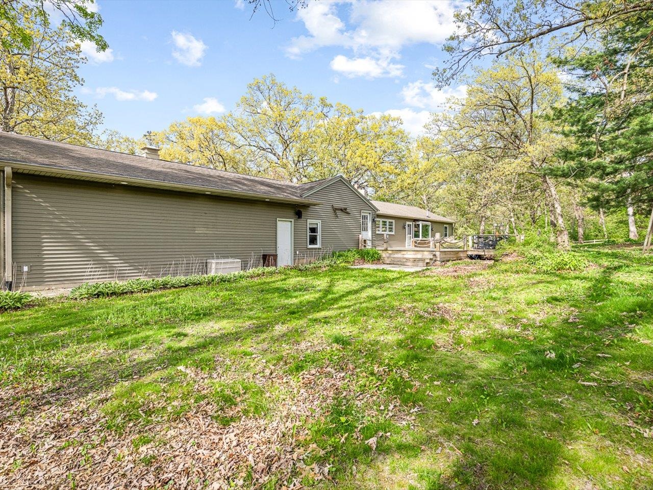 7785 Prairie Hill Road South Beloit, IL 61080 - Photo 12 of 46 a house view with a garden space