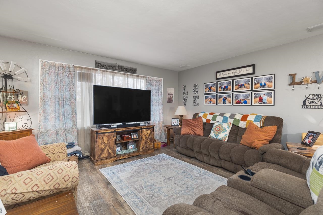 7785 Prairie Hill Road South Beloit, IL 61080 - Photo 14 of 46 a living room with furniture and a flat screen tv