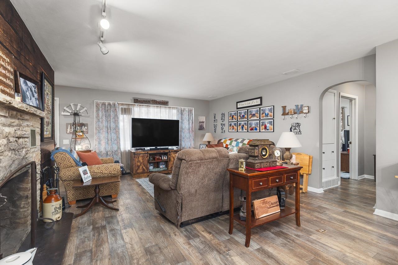 7785 Prairie Hill Road South Beloit, IL 61080 - Photo 16 of 46 a living room with furniture and a flat screen tv