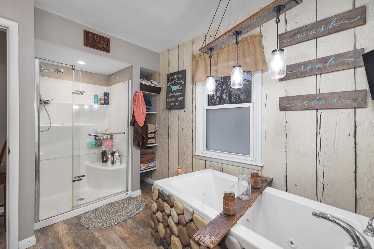 7785 Prairie Hill Road South Beloit, IL 61080 - Photo 23 of 46 a bathroom with a tub sink and shower