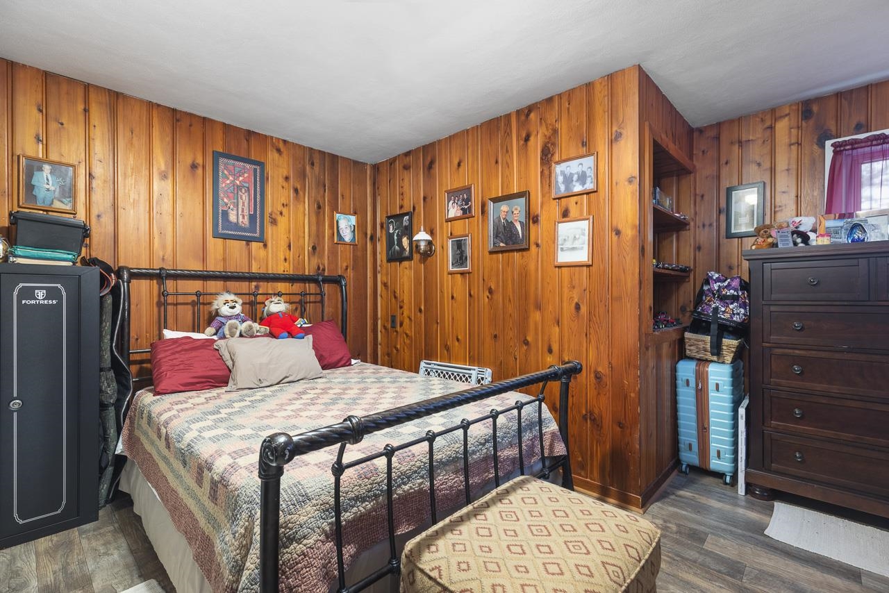 7785 Prairie Hill Road South Beloit, IL 61080 - Photo 24 of 46 a bedroom with a bed and wooden floor