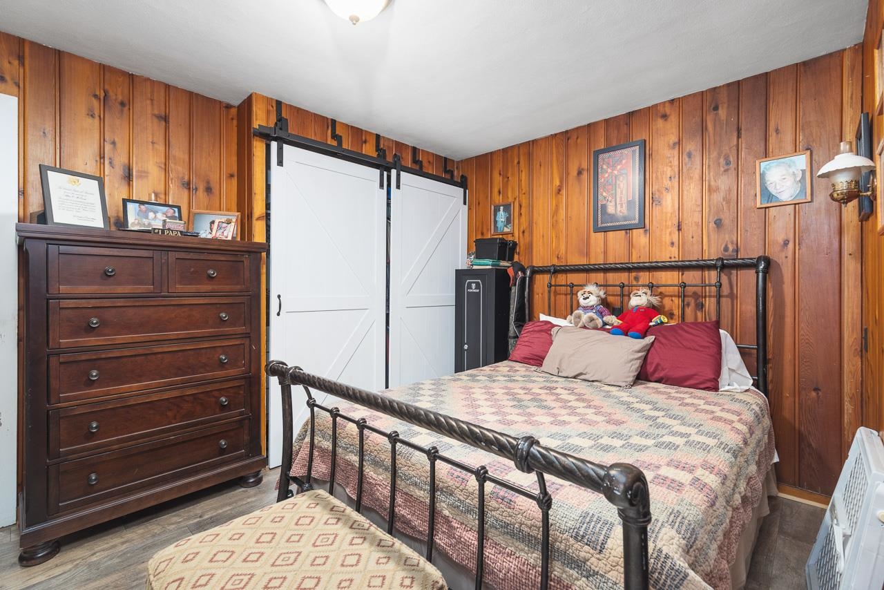 7785 Prairie Hill Road South Beloit, IL 61080 - Photo 25 of 46 a bedroom with a bed a dresser and a window