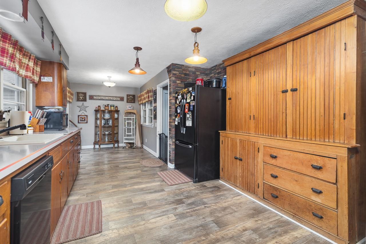 7785 Prairie Hill Road South Beloit, IL 61080 - Photo 26 of 46 a view of a kitchen with cabinets and wooden floor