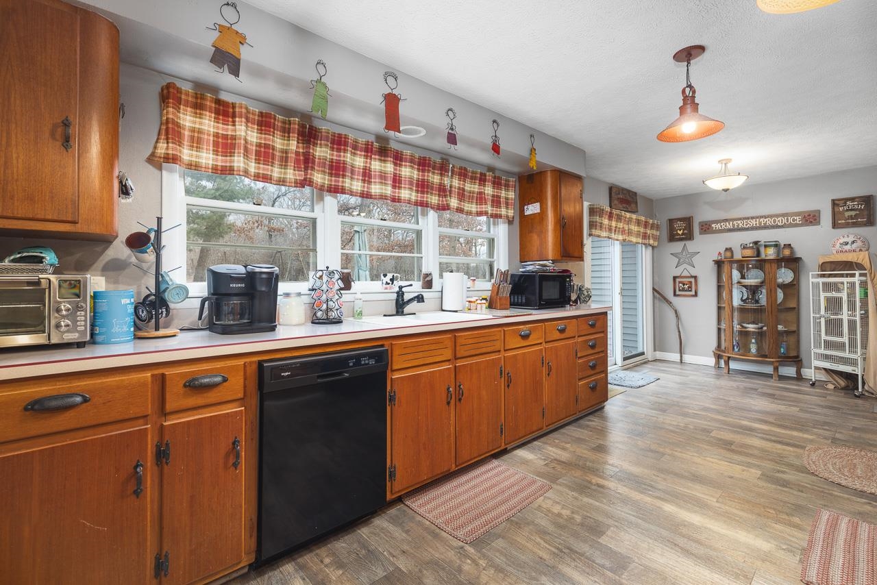 7785 Prairie Hill Road South Beloit, IL 61080 - Photo 27 of 46 a kitchen with stainless steel appliances granite countertop a sink and cabinets