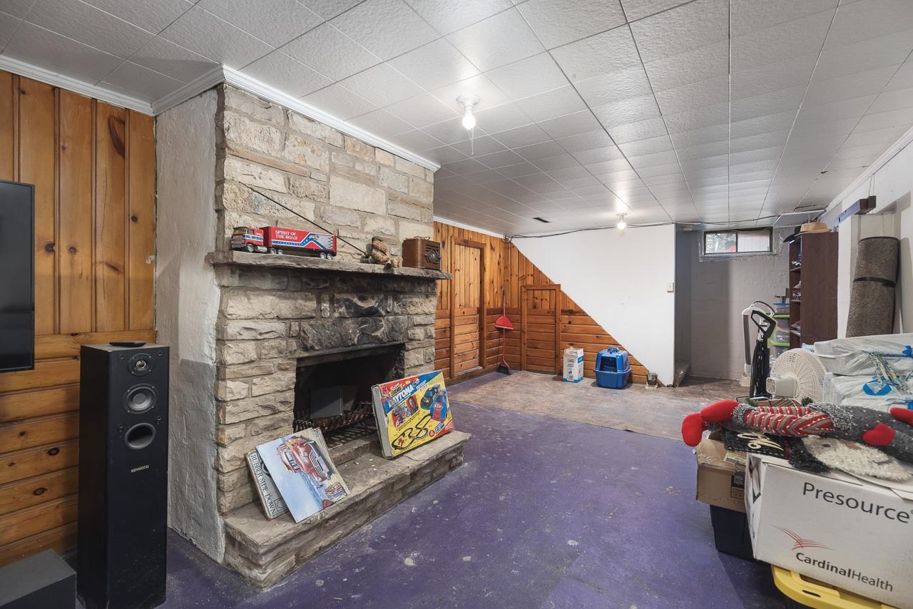7785 Prairie Hill Road South Beloit, IL 61080 - Photo 32 of 46 a view of a livingroom with furniture and a fireplace