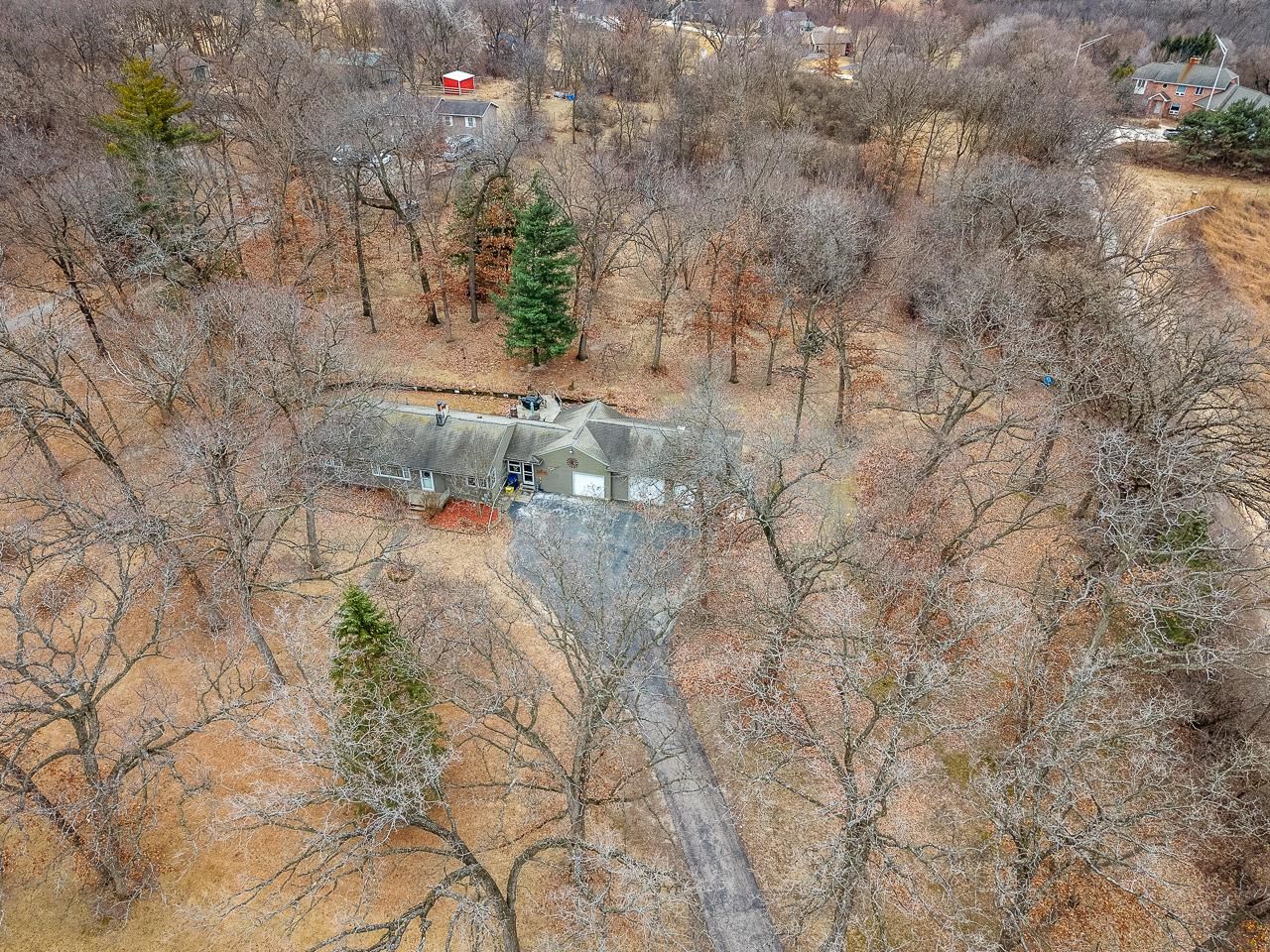 7785 Prairie Hill Road South Beloit, IL 61080 - Photo 36 of 46 a view of a dry yard with trees
