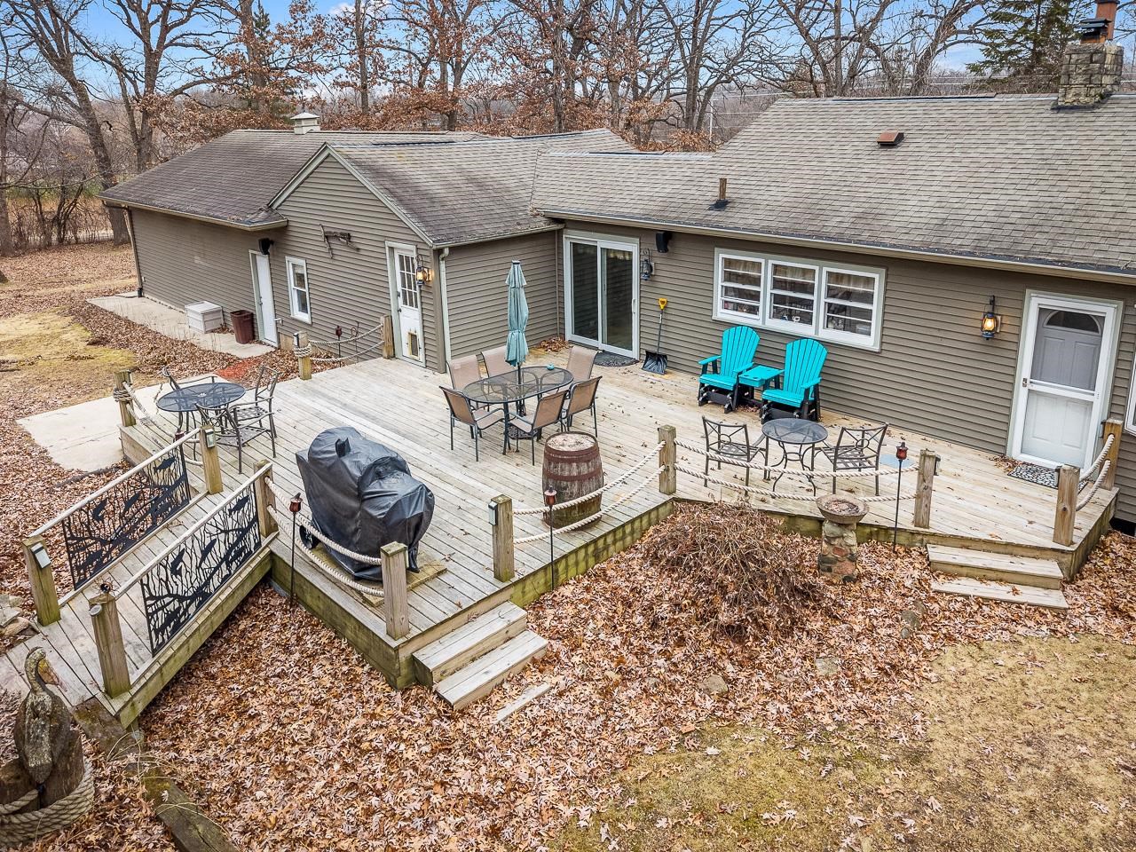7785 Prairie Hill Road South Beloit, IL 61080 - Photo 37 of 46 a view of a patio with a chairs and table in a patio