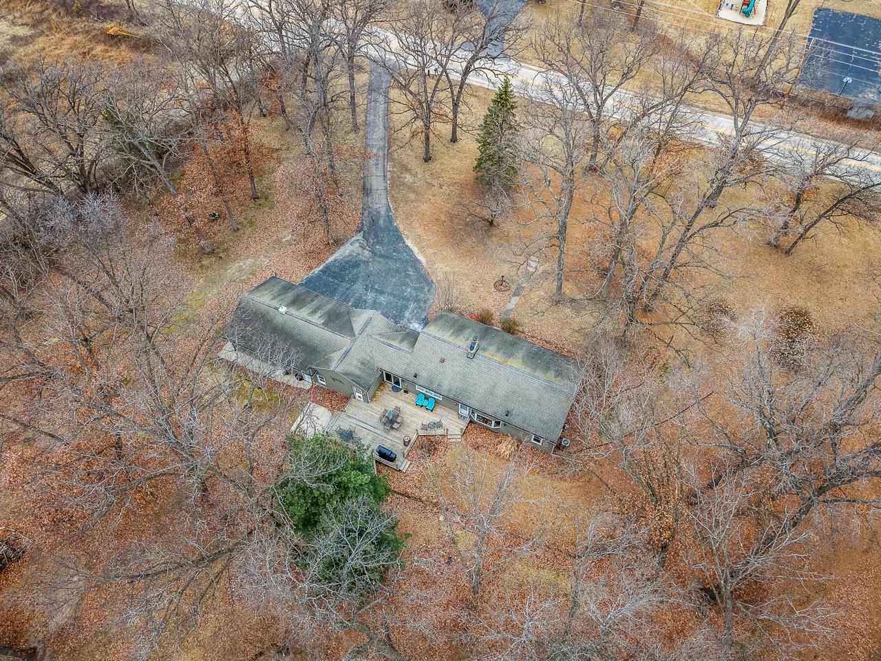 7785 Prairie Hill Road South Beloit, IL 61080 - Photo 42 of 46 a view of a yard with large trees