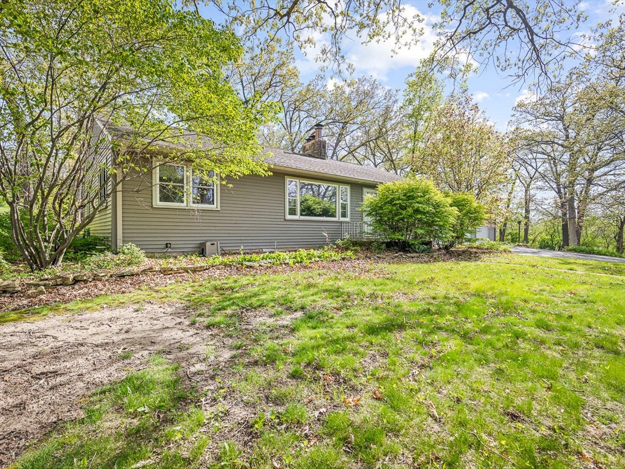 7785 Prairie Hill Road South Beloit, IL 61080 - Photo 5 of 46 a view of a house with yard and tree s