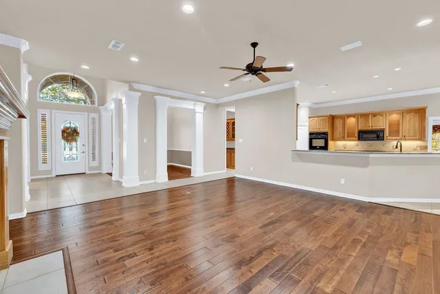 a view of a room with windows and chandelier