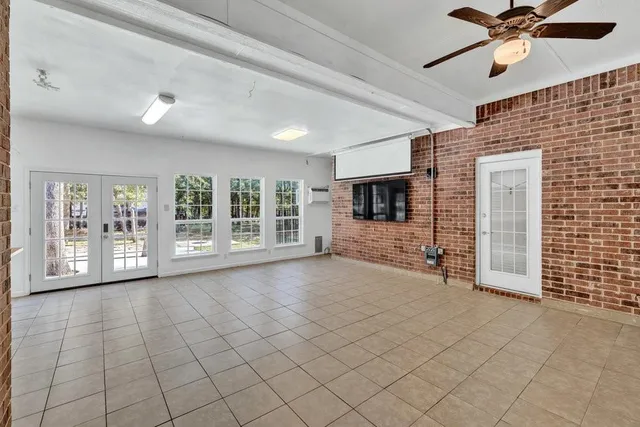 a view of a kitchen with furniture and an empty room