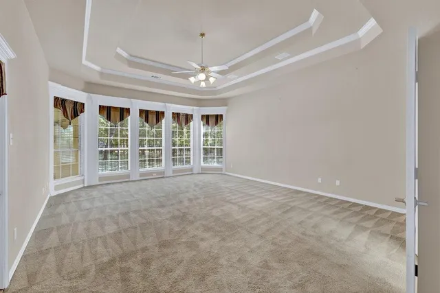 a spacious bathroom with a granite countertop double vanity sink and mirror
