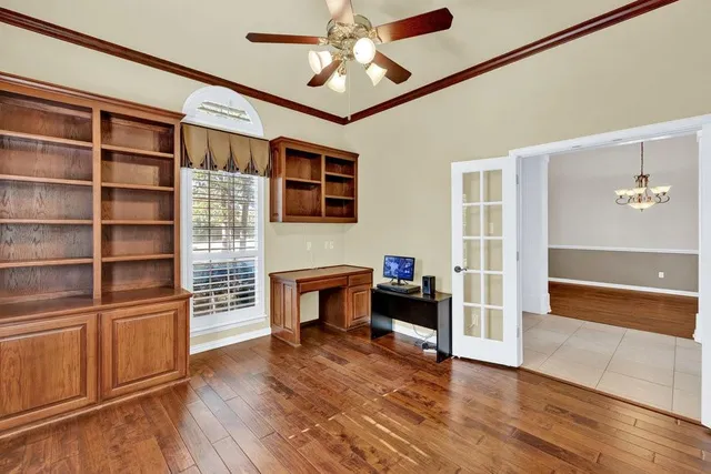 a bathroom with a toilet sink vanity and mirror