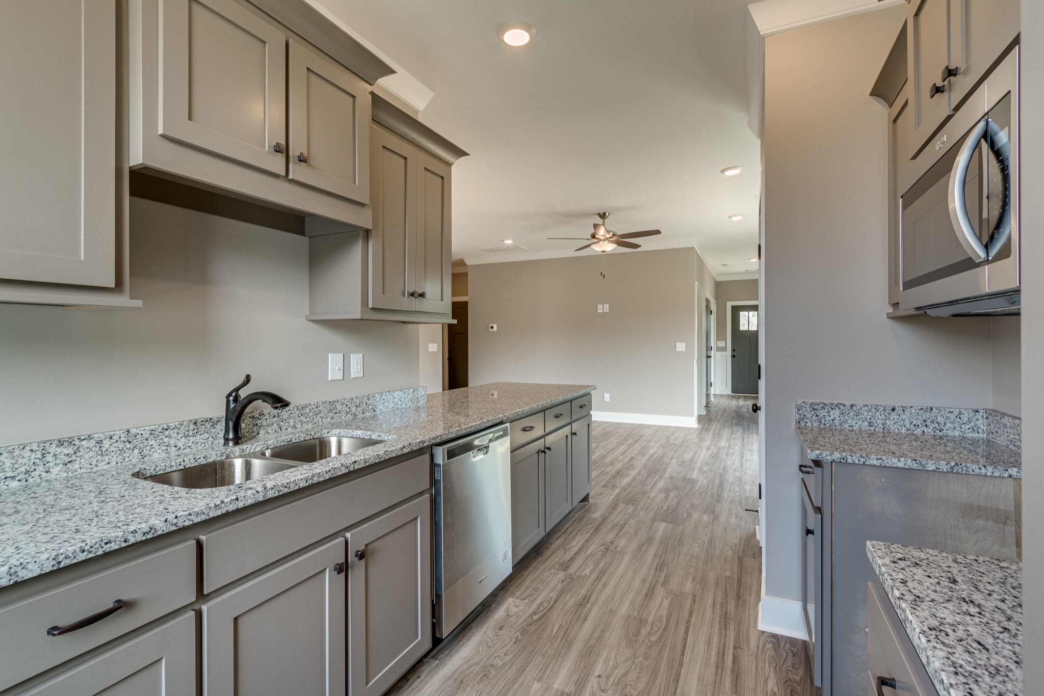 1905 Windhelm Drive Murfreesboro, TN 37129 - Photo 13 of 42 a kitchen with a sink cabinets and wooden floor
