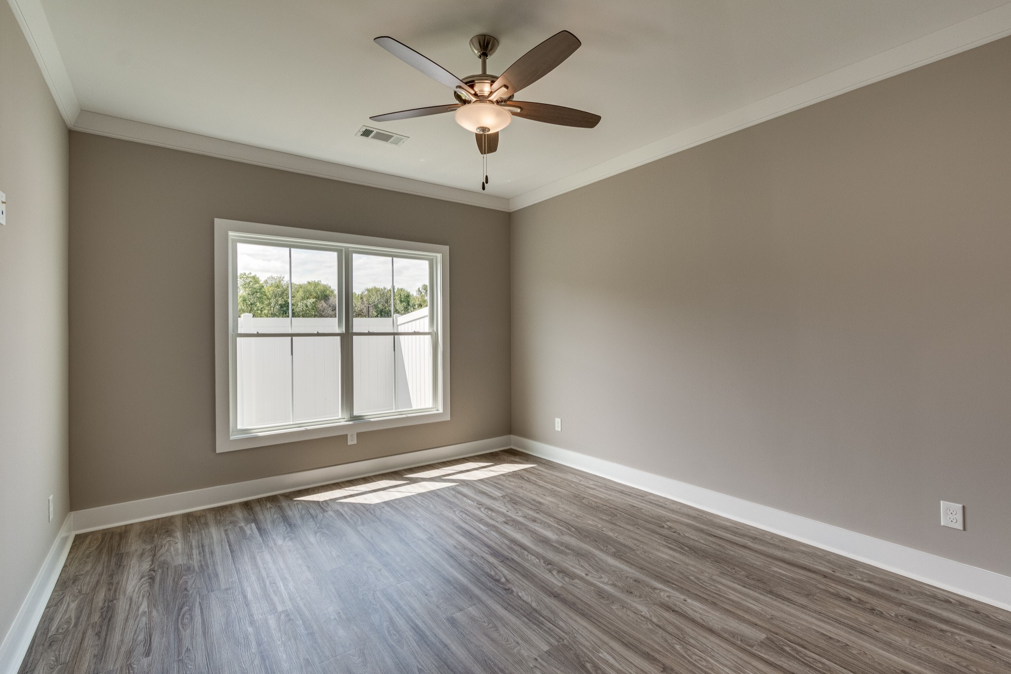 1905 Windhelm Drive Murfreesboro, TN 37129 - Photo 14 of 42 an empty room with wooden floor and windows