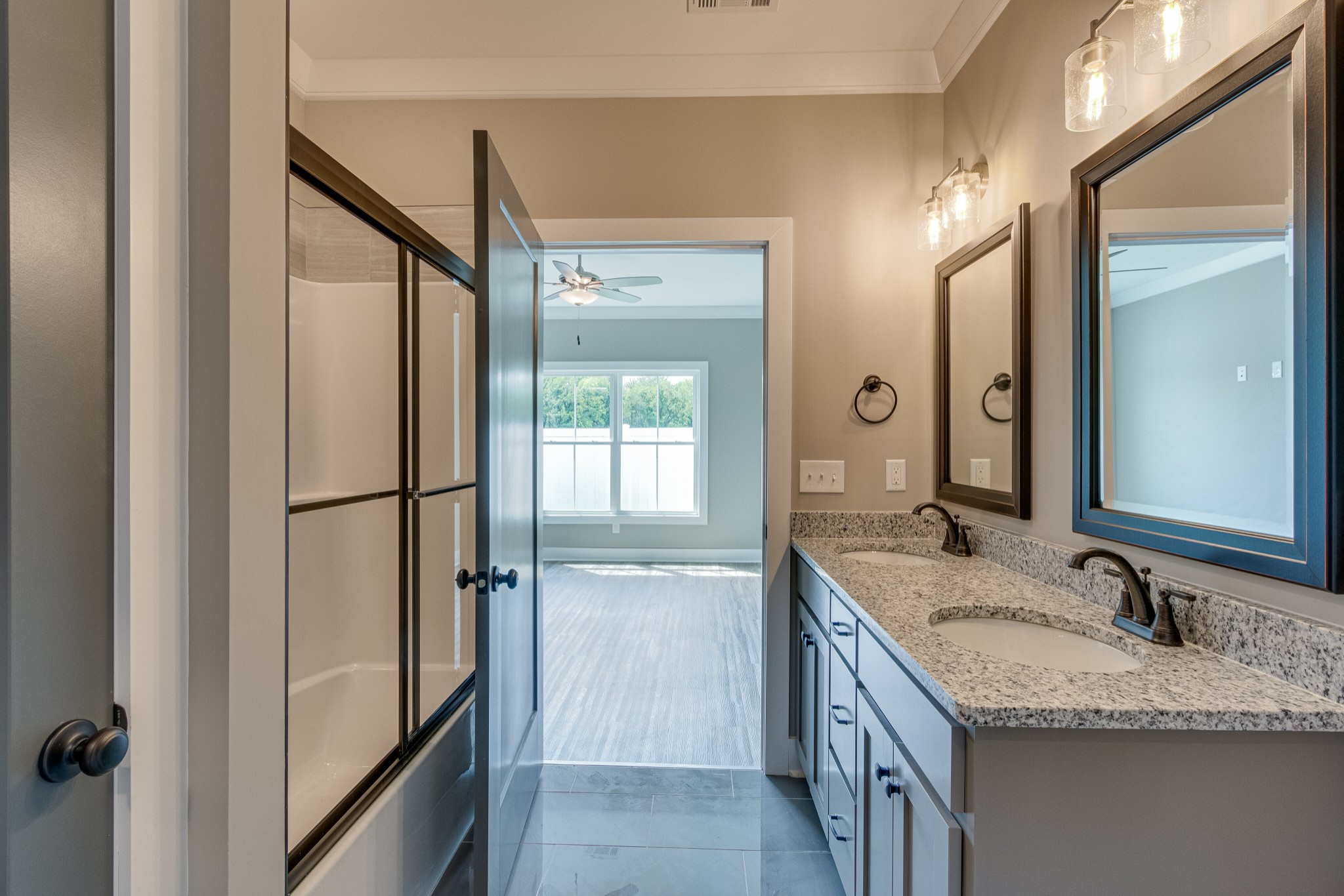 1905 Windhelm Drive Murfreesboro, TN 37129 - Photo 18 of 42 a bathroom with a granite countertop sink and a mirror