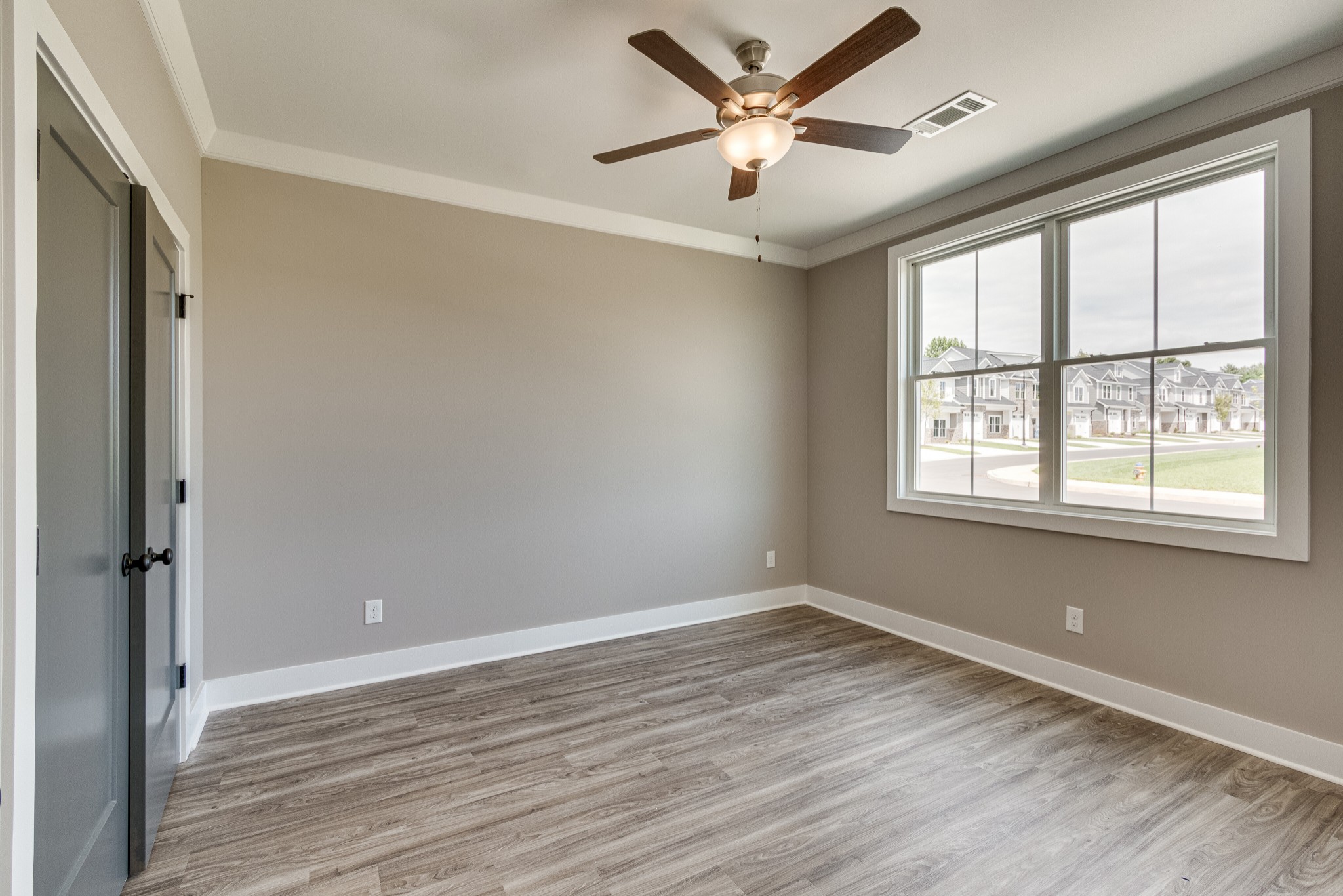 1905 Windhelm Drive Murfreesboro, TN 37129 - Photo 4 of 42 an empty room with wooden floor and windows