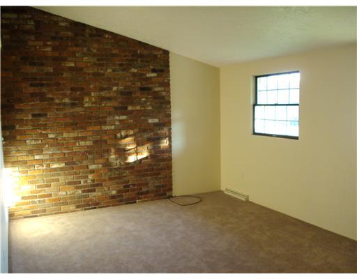1396 Dime Road Vandergrift, PA 15690 - Photo 5 of 18 Living Room. The Living Room Showcases New Carpeting, Unique Half-Cathedral Ceilings, and a Decorative Bricked Wall for that specal touch.