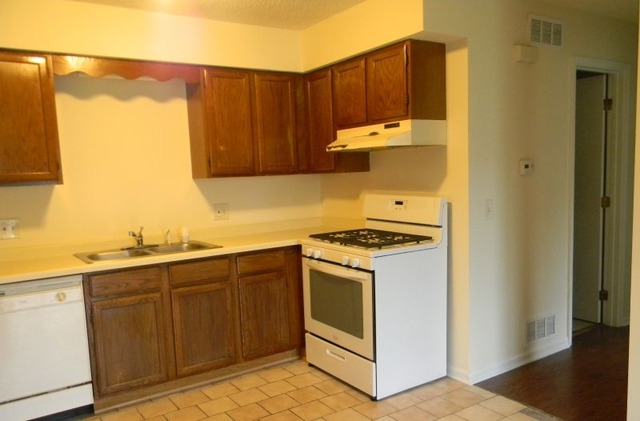 993 Kane Street, Unit 993 South Elgin, IL 60177 - Photo 12 of 15 a kitchen with a sink and a stove