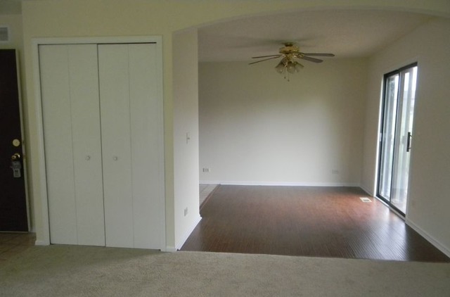 993 Kane Street, Unit 993 South Elgin, IL 60177 - Photo 13 of 15 an empty room with a door