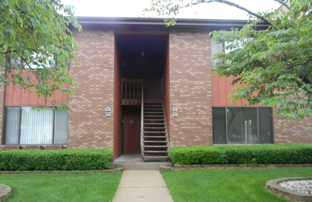 993 Kane Street, Unit 993 South Elgin, IL 60177 - Photo 14 of 15 a front view of a house with a yard