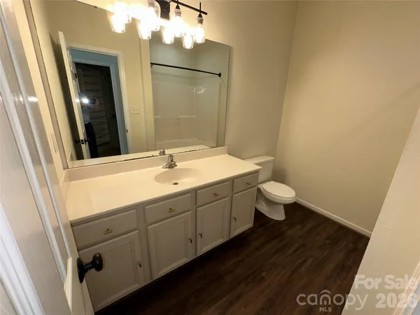 a bathroom with a tub and shower